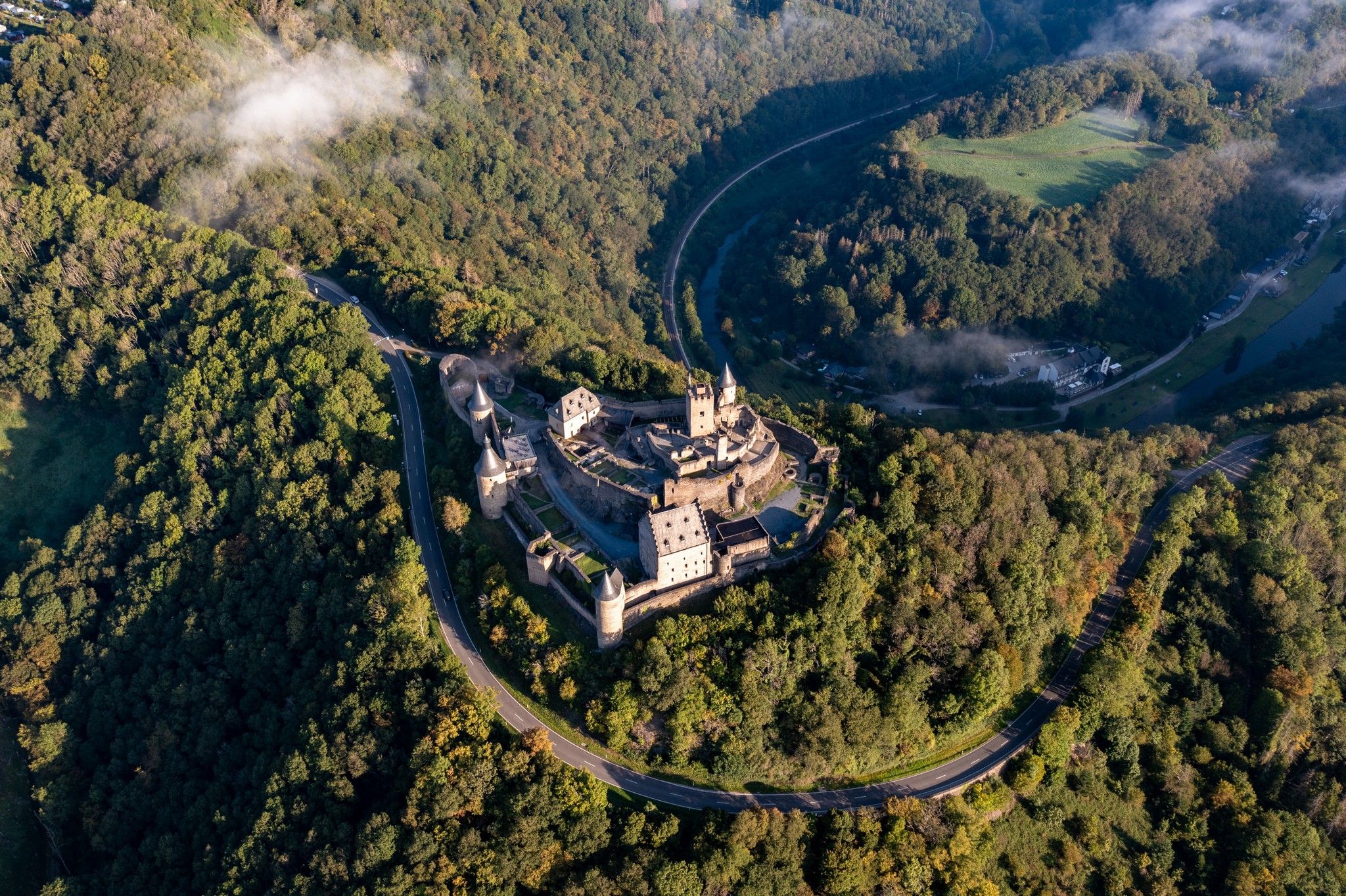Drone shot of Bourscheid Castle in summer, a popular destination, the largest castle of the Eislek region.