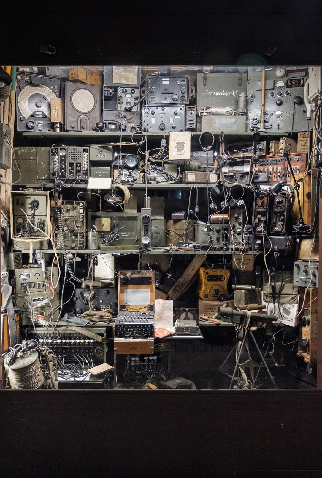 A shot of a shelf at the Museum of Military History in Diekirch, a very popular museum. The image shows several radios from World War II as well as typewriters.