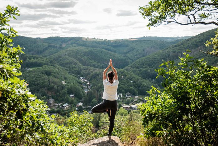 Woman doing yoga with a view