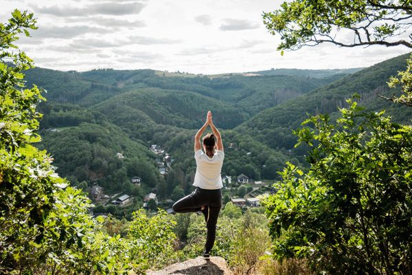 Woman doing yoga with a view